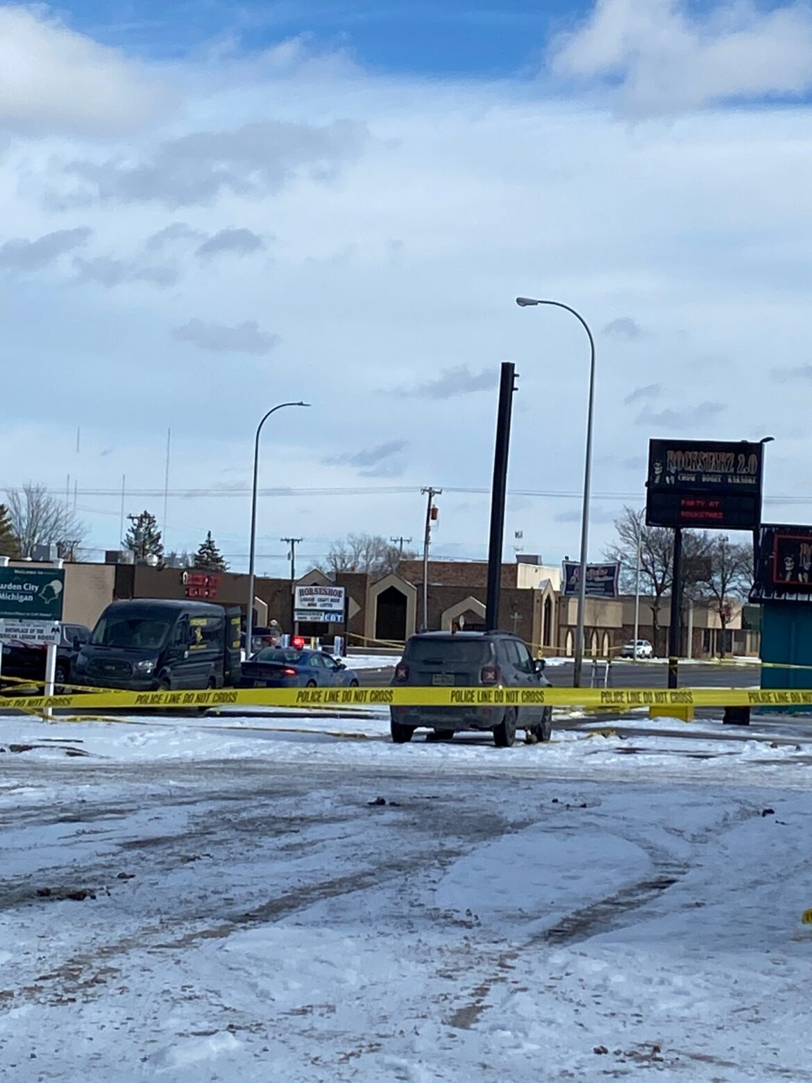 Police conducting “active investigation” at Garden City bar Crime Tape and police cars