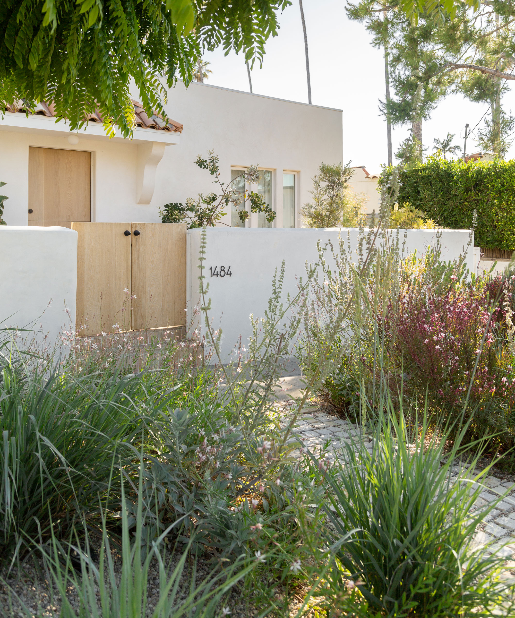 natural mosaic planting beds with perennials and ornamental grasse