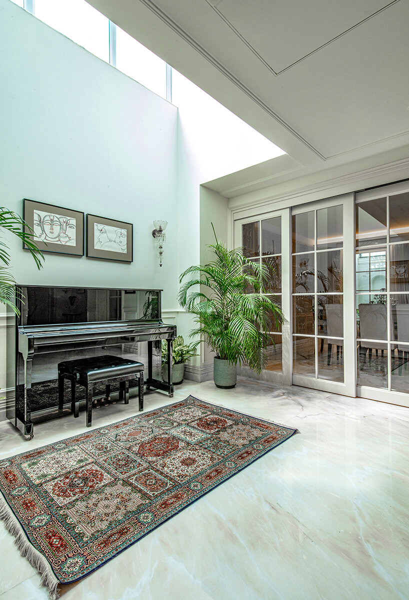 mayfair garden residence is defined by crafted layered textures and natural light in india