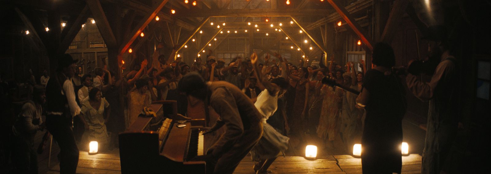 Image may contain Norman Brown Lighting Concert Crowd Person Dancing Leisure Activities Adult Urban Face and Head