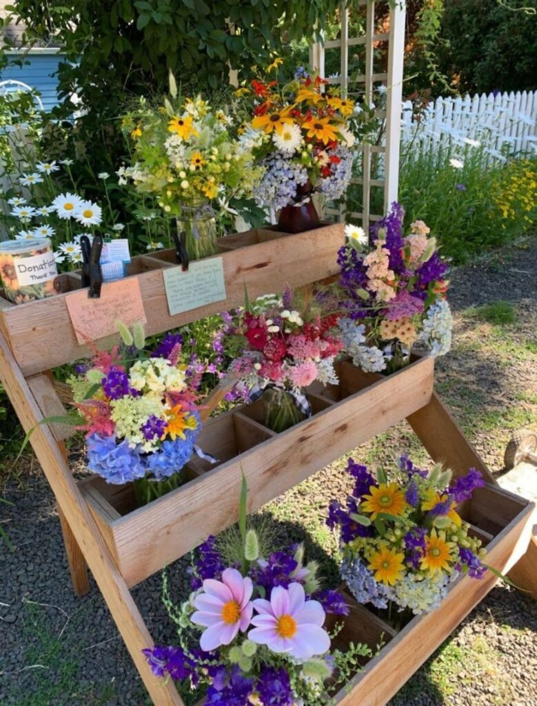 This is the flower stand my neighbor does every summer to benefit the food bank 💐