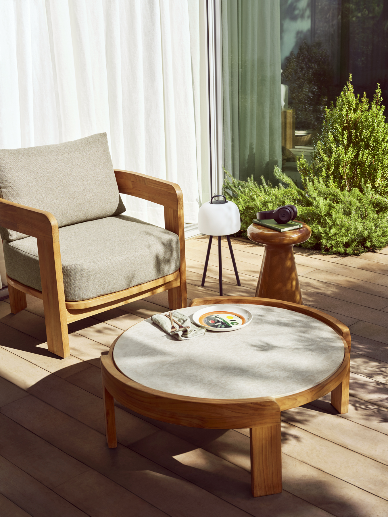 Yerra outdoor sofa and armchairs on a wooden deck.