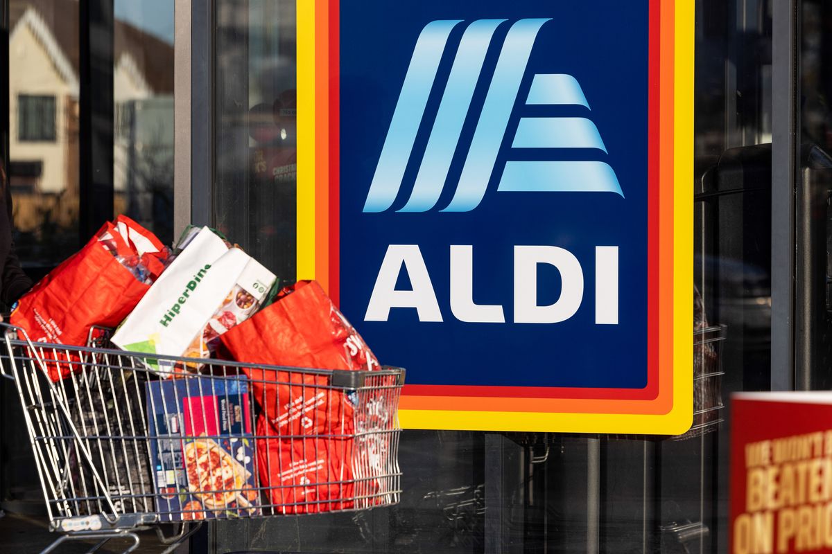 A customer leaves an Aldi Stores Ltd. supermarket in Benfleet, UK