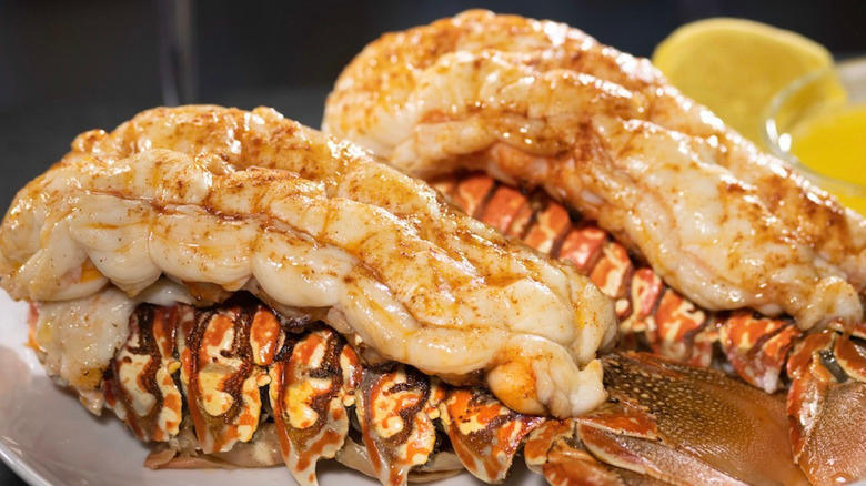 Two lobster tails served with lemon and butter at Eddie V's Prime Seafood restaurant