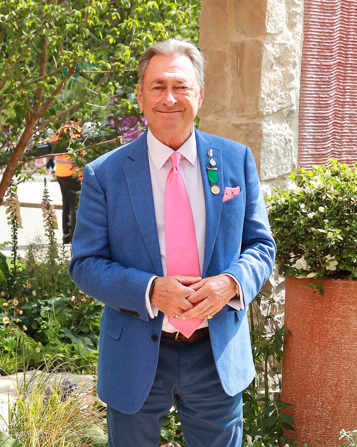 Alan Titchmarsh walks through the Killik & Co 'Save for a Rainy Day' Garden at Chelsea Flower Show on May 19, 2025 in London, England.