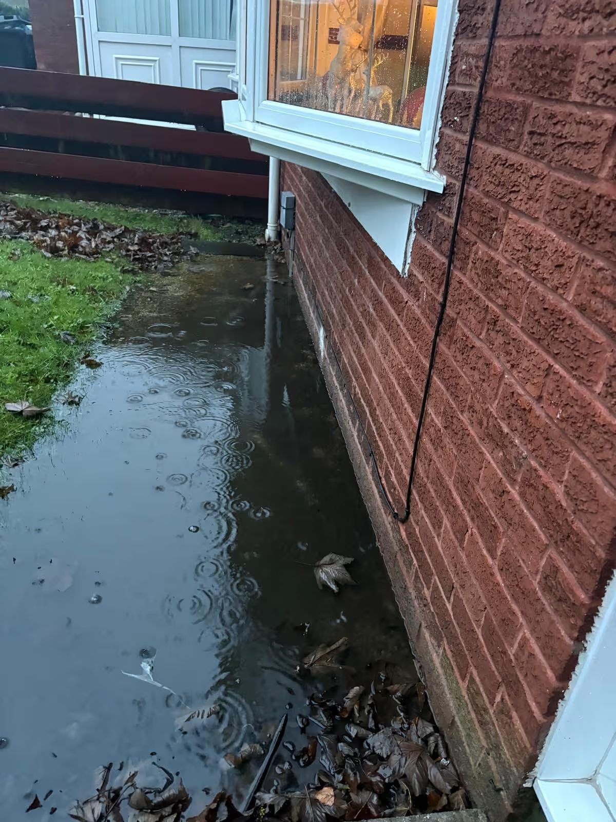Huge puddle at base of home