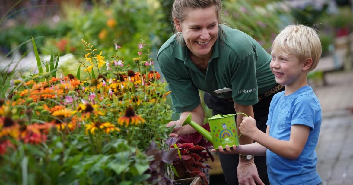 Children learn composting and planting at Dobbies event