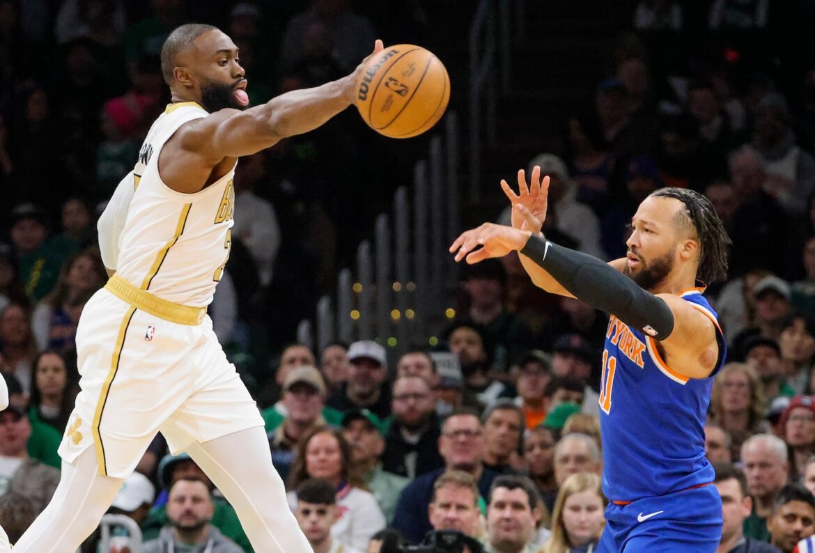 Celtics guard Jaylen Brown (left) deflects a pass by Knicks guard Jalen Brunson to force a turnover during the first quarter on Sunday.