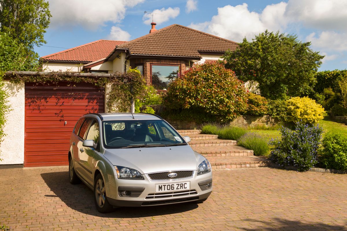Bungalow driveway, garage and front garden