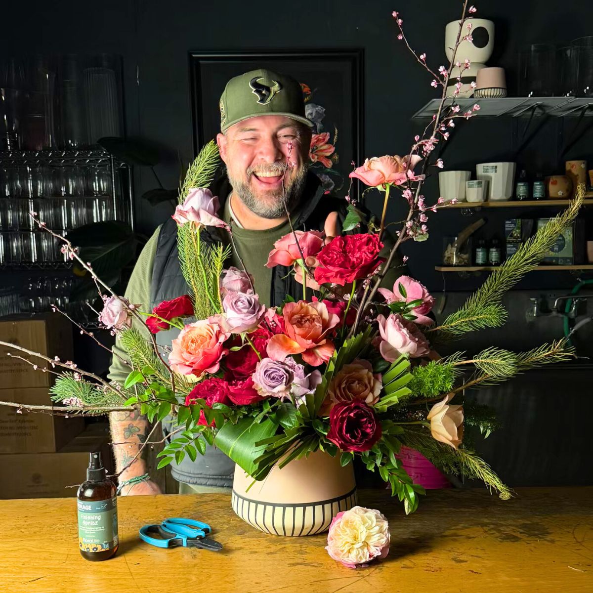 Ace Berry floral designer with an arrangement