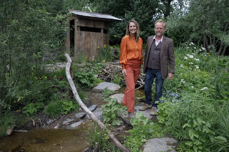 Best-in-show garden designers Lulu Urquhart and Adam Hunt posing in their garden Rewilding Great Britain Landscape at the RHS Chelsea Flower Show. Photograph: Luke Macgregor/PA