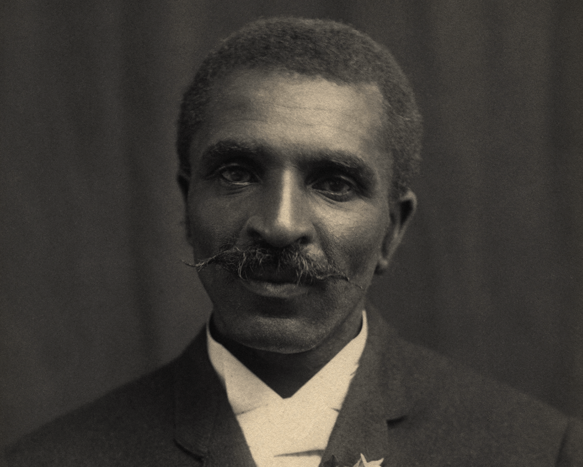 A sepia-toned portrait of George Washington Carver.