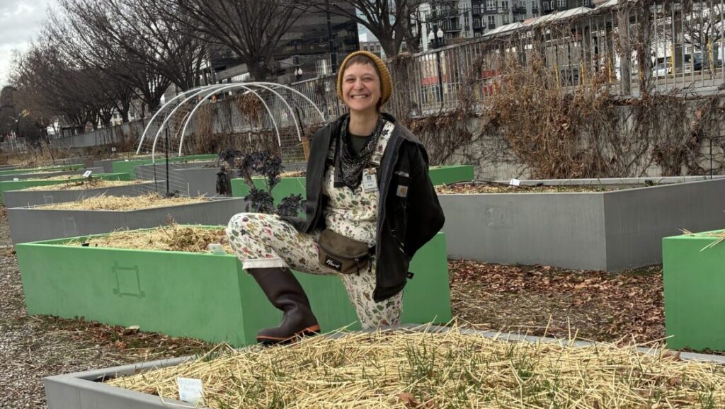 Growing a garden doesn’t just feed yourself, it can build resilience and community connections Garden Associate and Seed Librarian Rikki Longino stands in a garden plot at the library and at the...