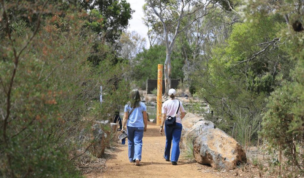 two people walking into the Sensory Garden at Serendip Sanctuary