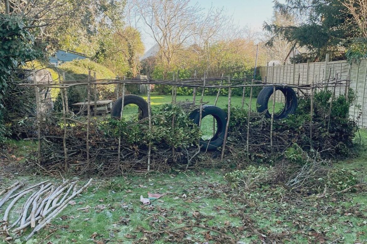 Why You Should Recycle Branches to Build a DIY Dead Hedge
