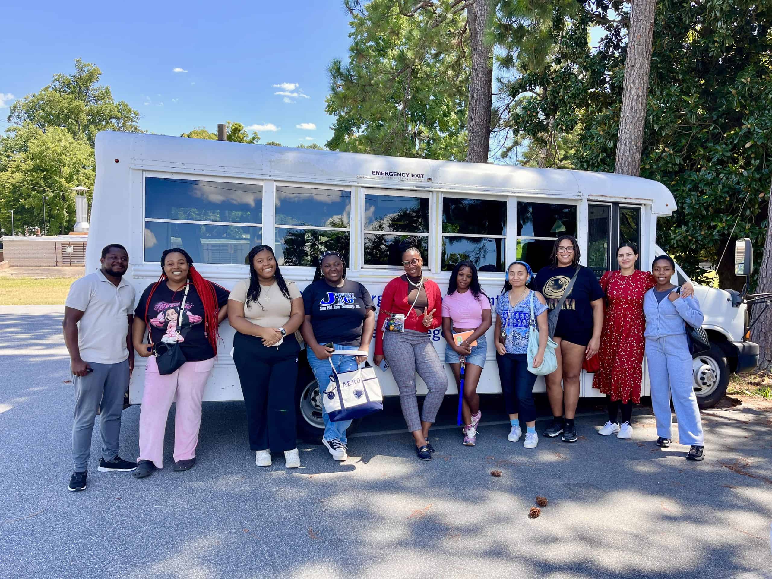 Bennett College students pose together during a field trip focused on food justice and community-based learning.