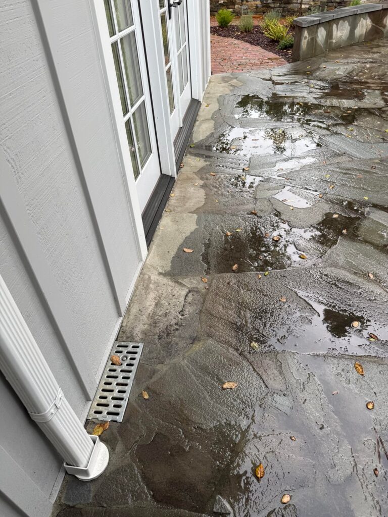 Water pooling in patio and moving towards edges. Water pooling in patio and moving towards edges.