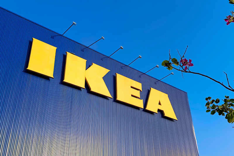 IKEA Store sign and logo hanging on the store building with a natural complement. The world's largest retailer of interior and exterior products needed.