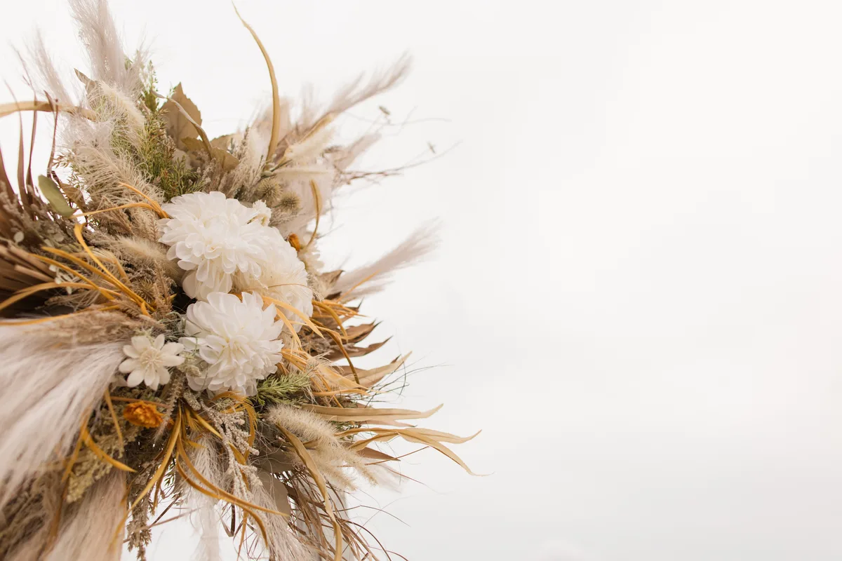 Soft Pastel Beach Wedding Decor with Burlap, Rustic White Wood, Rattan, Ivory-Colored Roses, Cream Stock Spray Flowers & Sage-Green Eucalyptus for a Modern Rustic Beach Wedding 