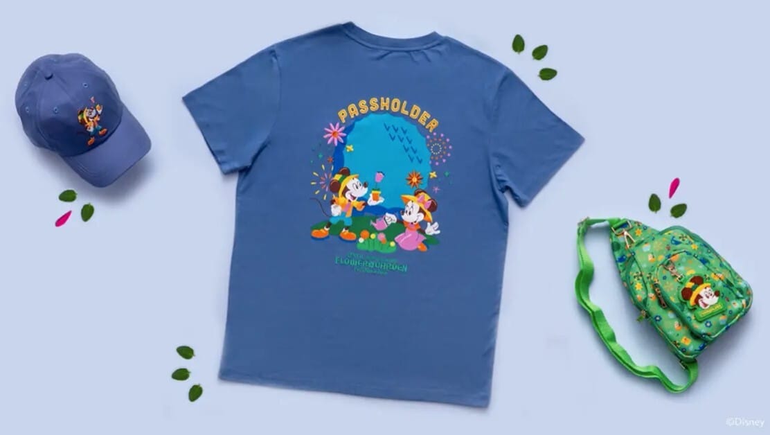 Disney shared a preview of the Annual Passholder merchandise that will be available at the 2026 EPCOT Flower & Garden Festival. including a t-shirt, baseball cap, and a crossbody bag.