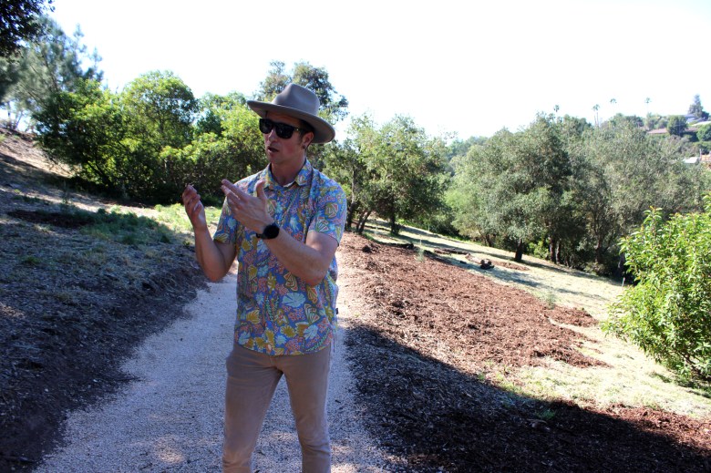 Keith Nevison, director of horticulture and operations, leads a tour of the new Torrey Pine Conservation Grove at the Santa Barbara Botanic Garden.