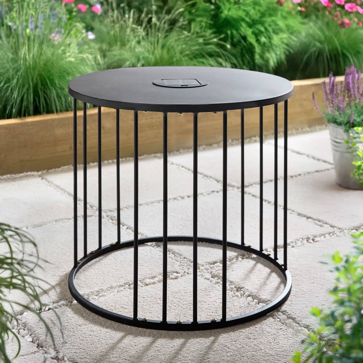 The metal table has a modern, rounded design