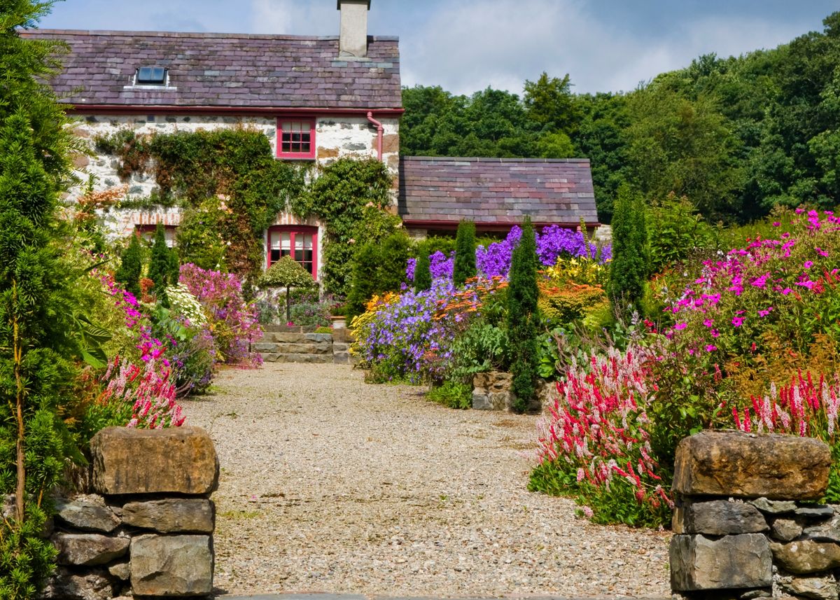 Herbaceous border and garden cottage at Plas Cadnant