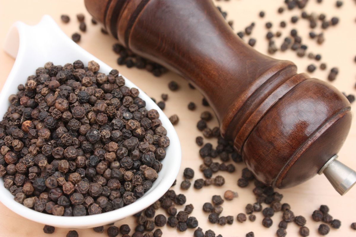 Black pepper in grains  Pepper mill