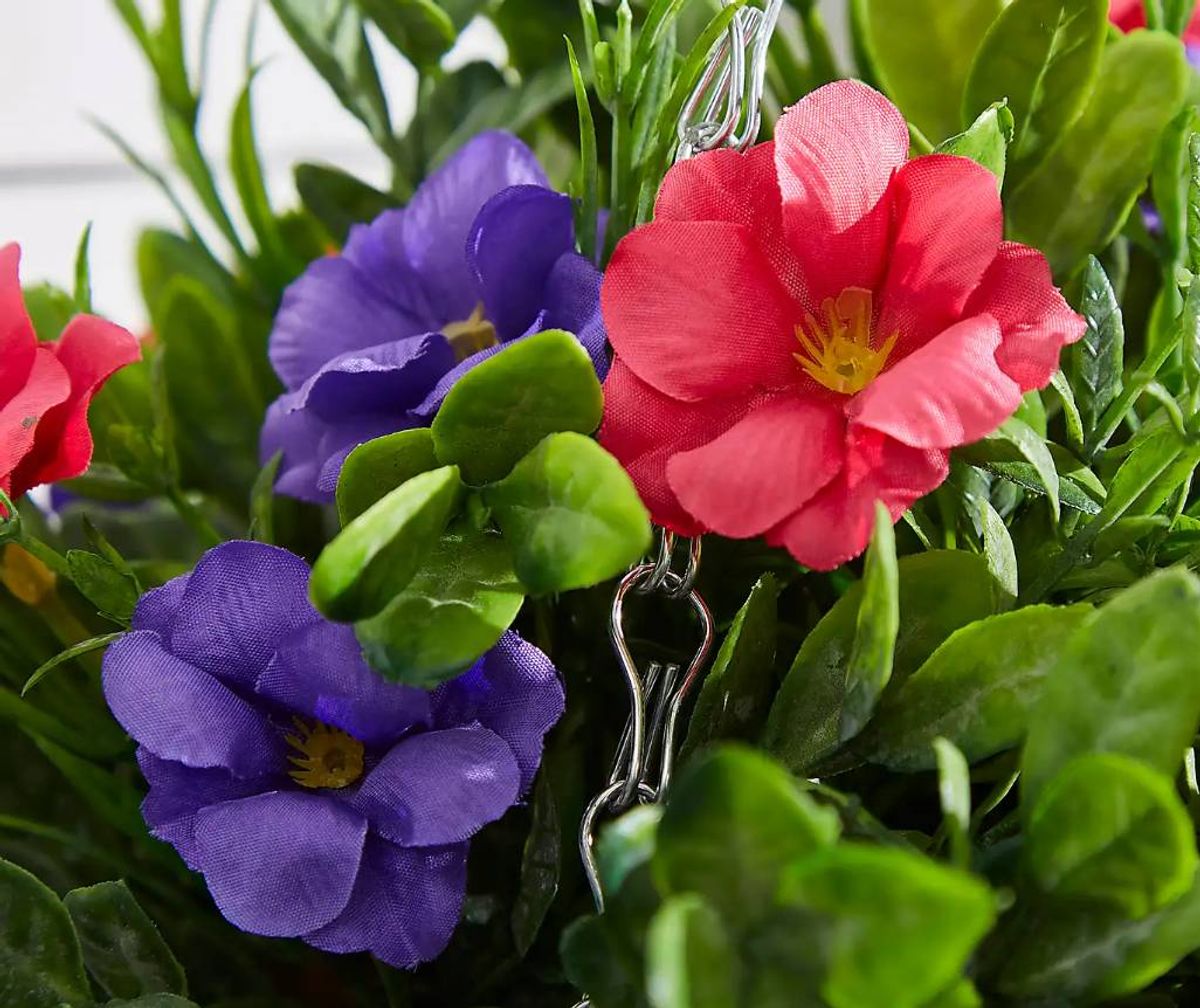 The artificial petunia plants come in a cone-shaped hanging basket