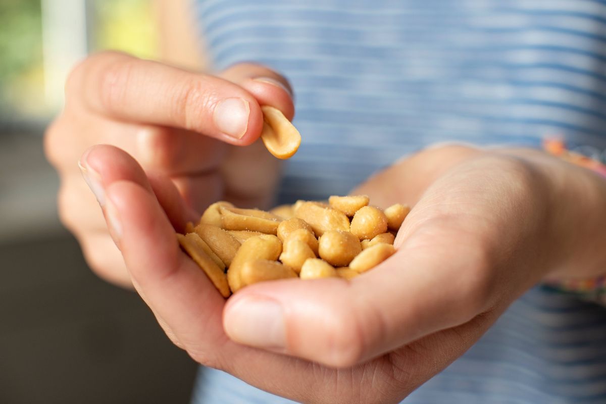 Close Up Of Handful Of Salted Peanuts