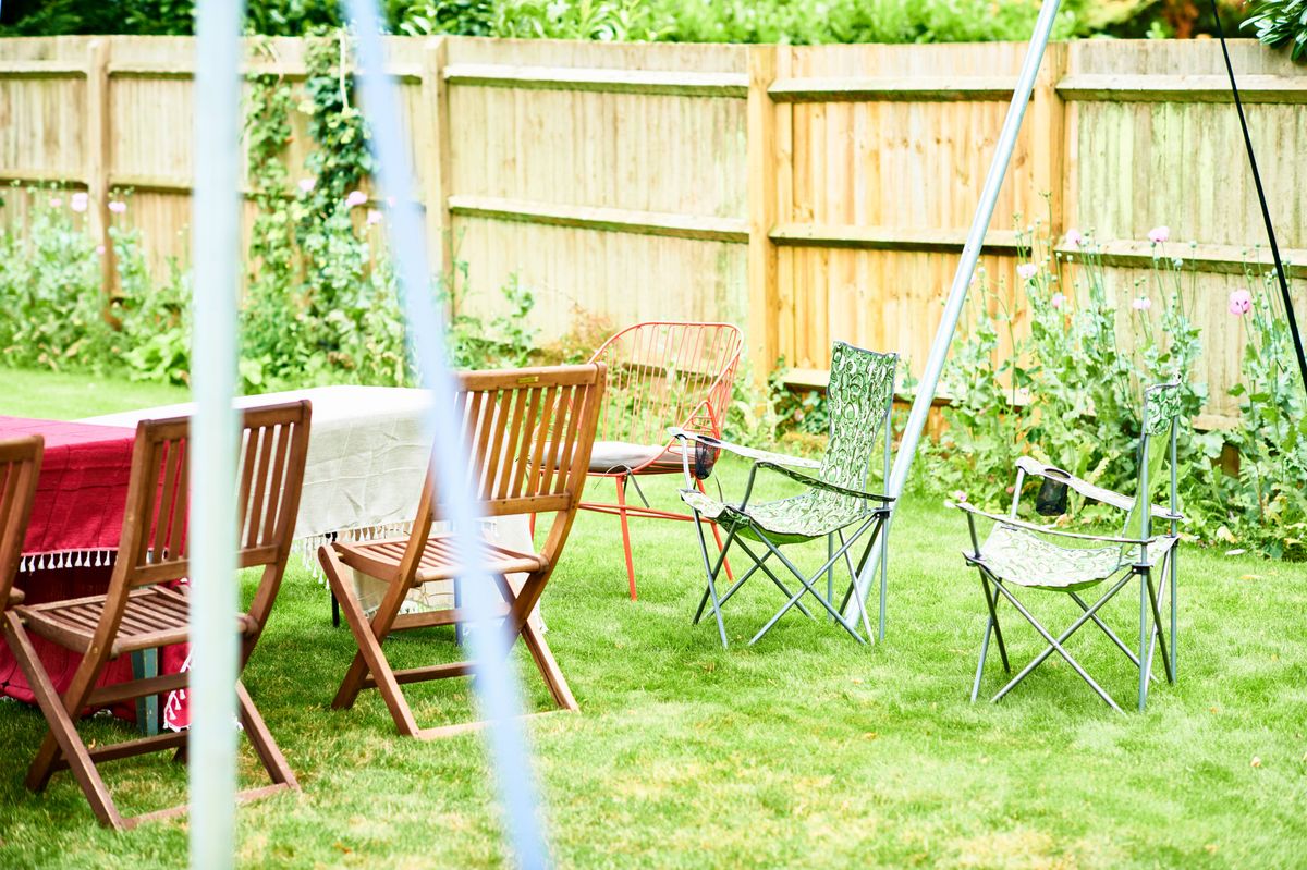 Various chairs on lawn ready for garden party