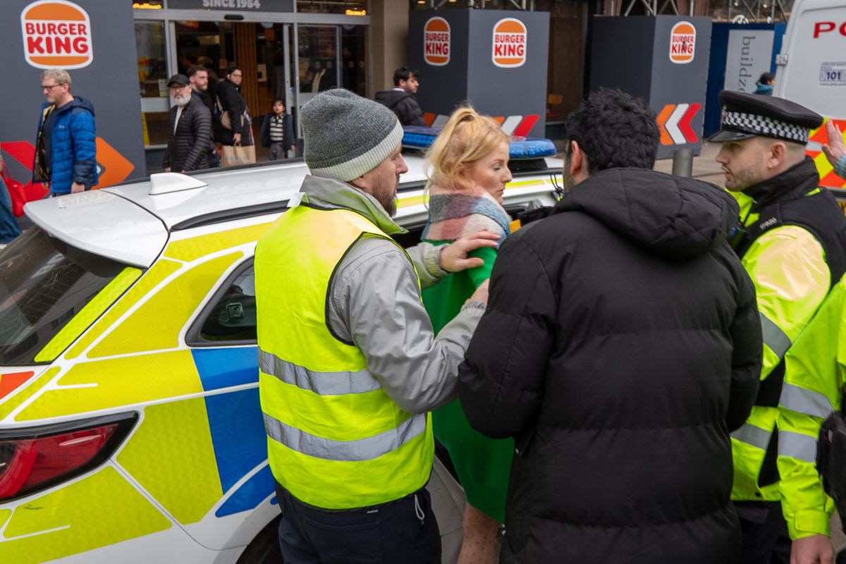 MP Hannah Spencer was ushered away by police as the event turned violent