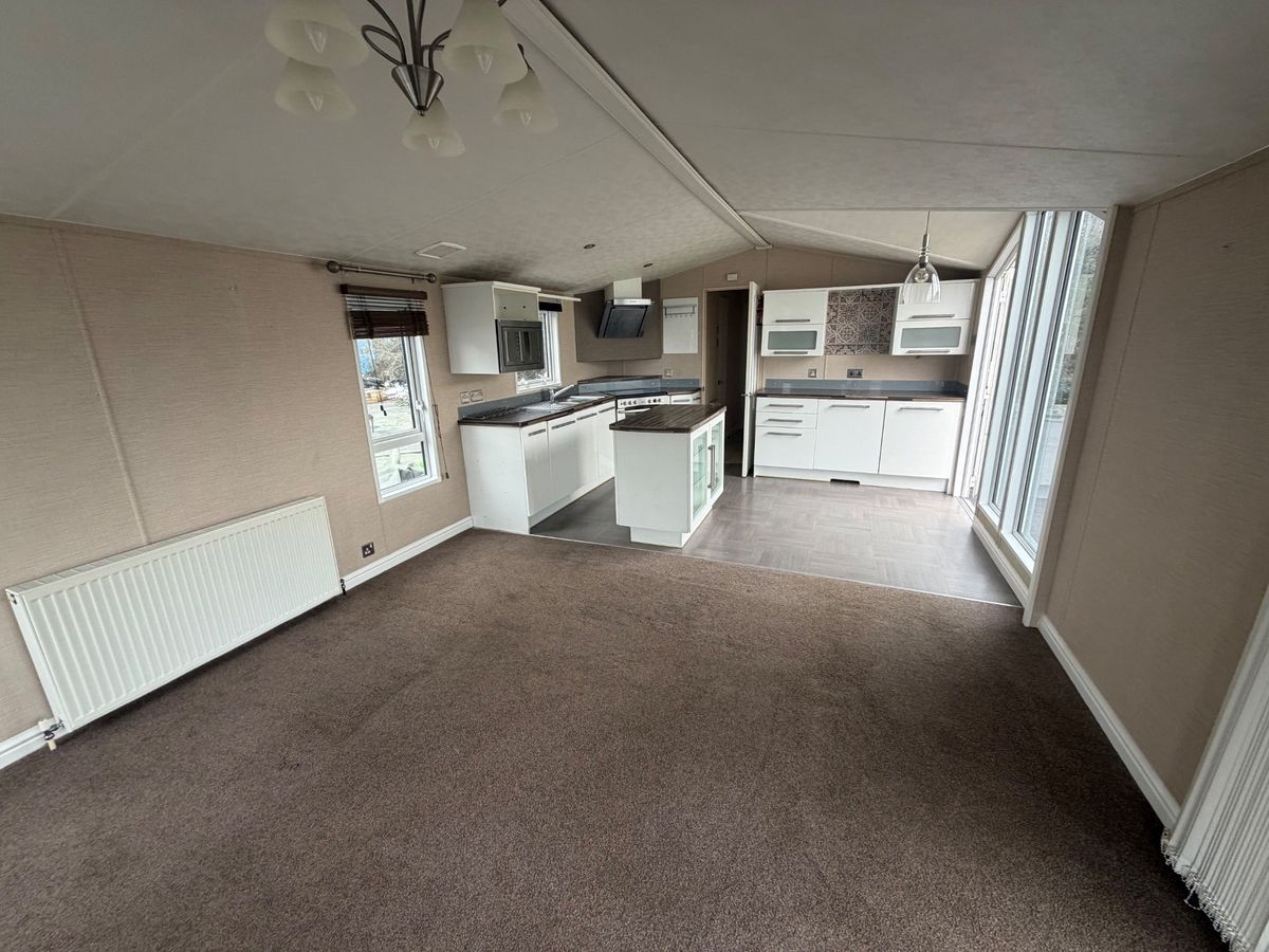 Open plane living room and kitchen inside the caravan