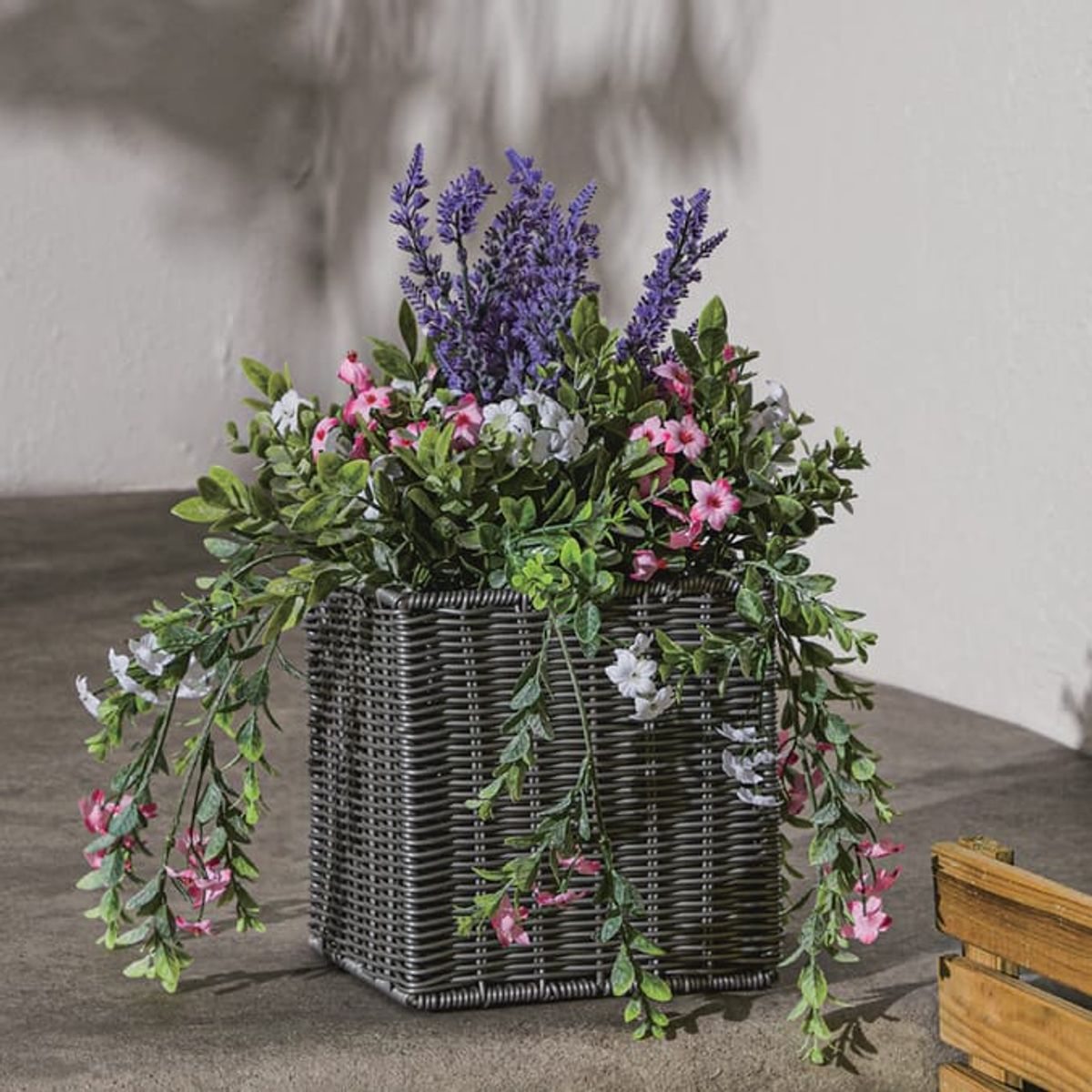 The Jardin Artificial Flower In Rattan Planter is £14.99