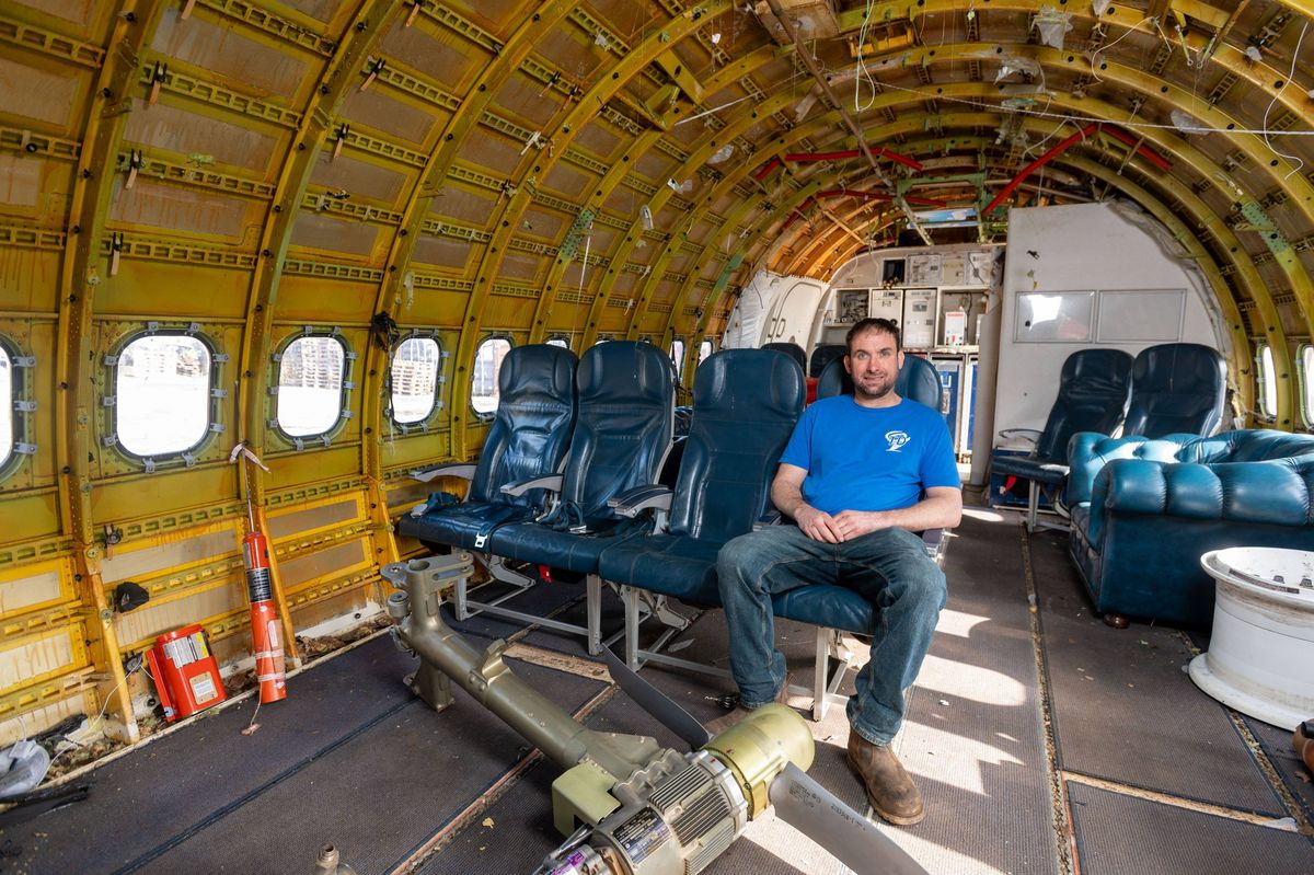 Dave Billings with his 737 fuselage, that he is burying in his garden to extend his current underground shelter into a WW3-ready bunker, near Derby.