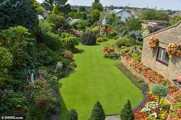 Pictured: Mr Grindle's glorious garden. After the UK has experienced its rainiest start to the year since 1908, the gardening expert is on hand to provide his tips and tricks