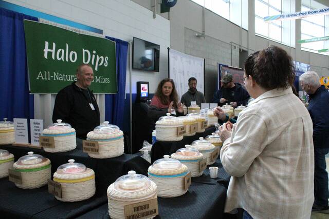<p>Attendees try various sweet and savory dips with pretzels at the Halo Dips table.</p>
                                 <p>Sydney Allabaugh | Times Leader</p>