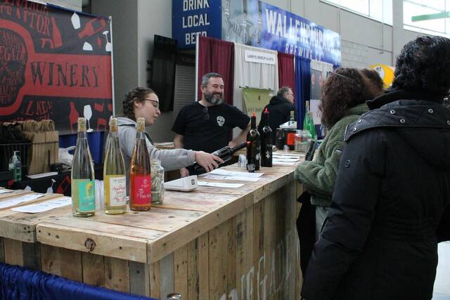 <p>Attendees try wine samples at The Renegade Winery stand.</p>
                                 <p>Sydney Allabaugh | Times Leader</p>