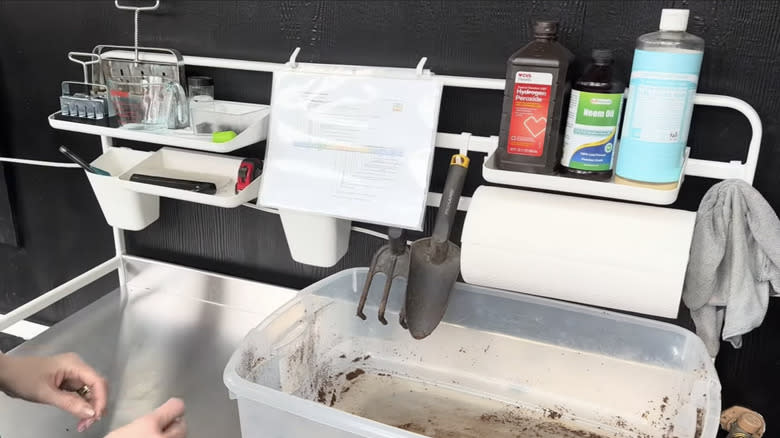 IKEA SUNNERSTA kitchenette configured as a potting bench station with storage accessories for tools