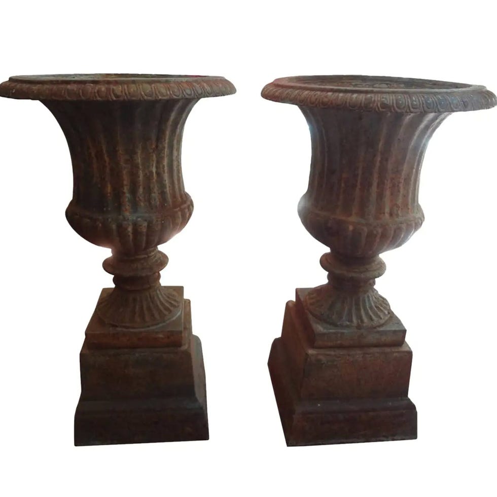Pair of 19th Century French Neoclassical Style Iron Urns on Plinths