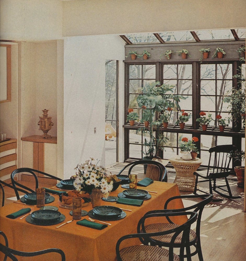 dining area with a view of a sunlit room filled with plants