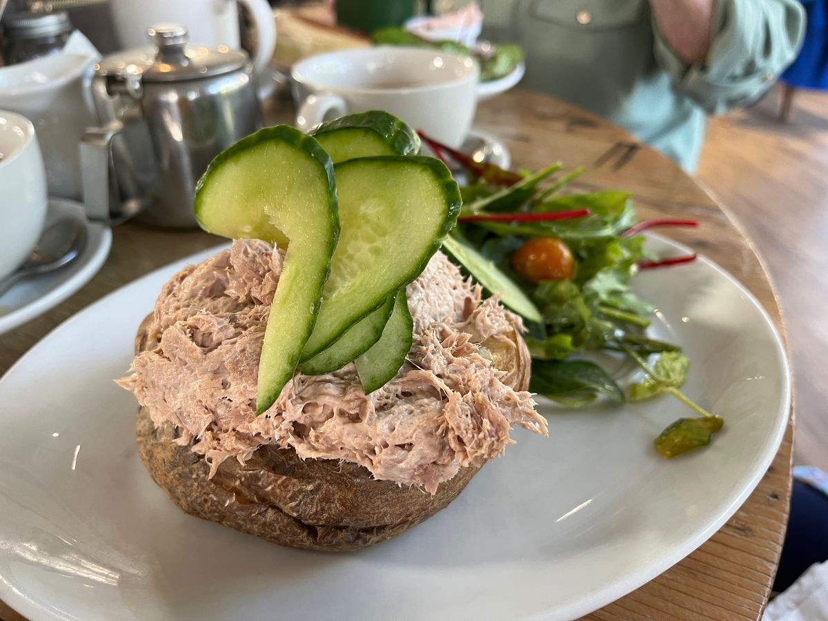 Jacket potato with tuna mayonnaise and cucumber
