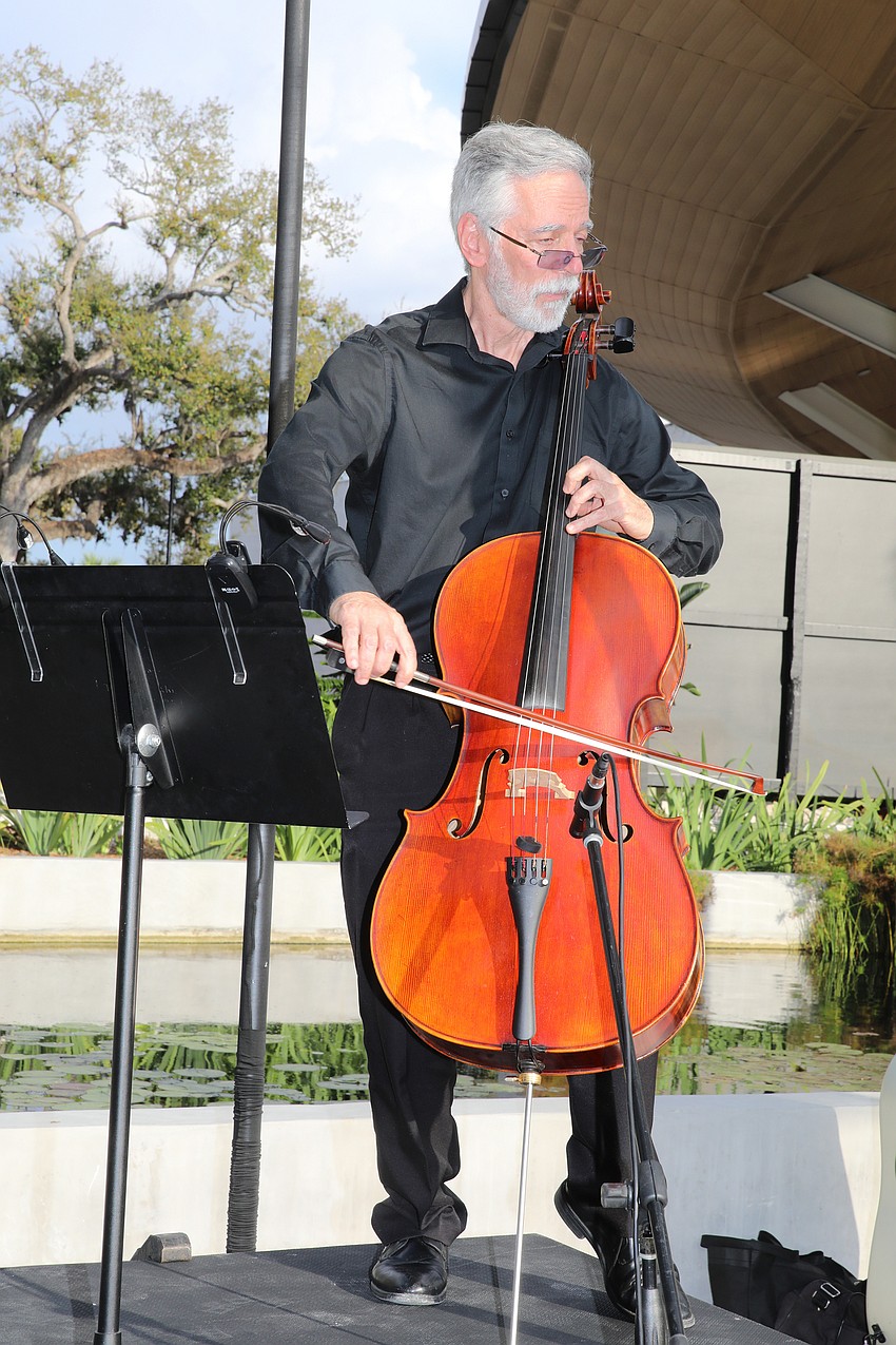 Cellist Diego Villa plays light classical and contemporary music for guests.