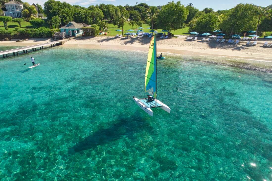 A person on a catamaran on a beach