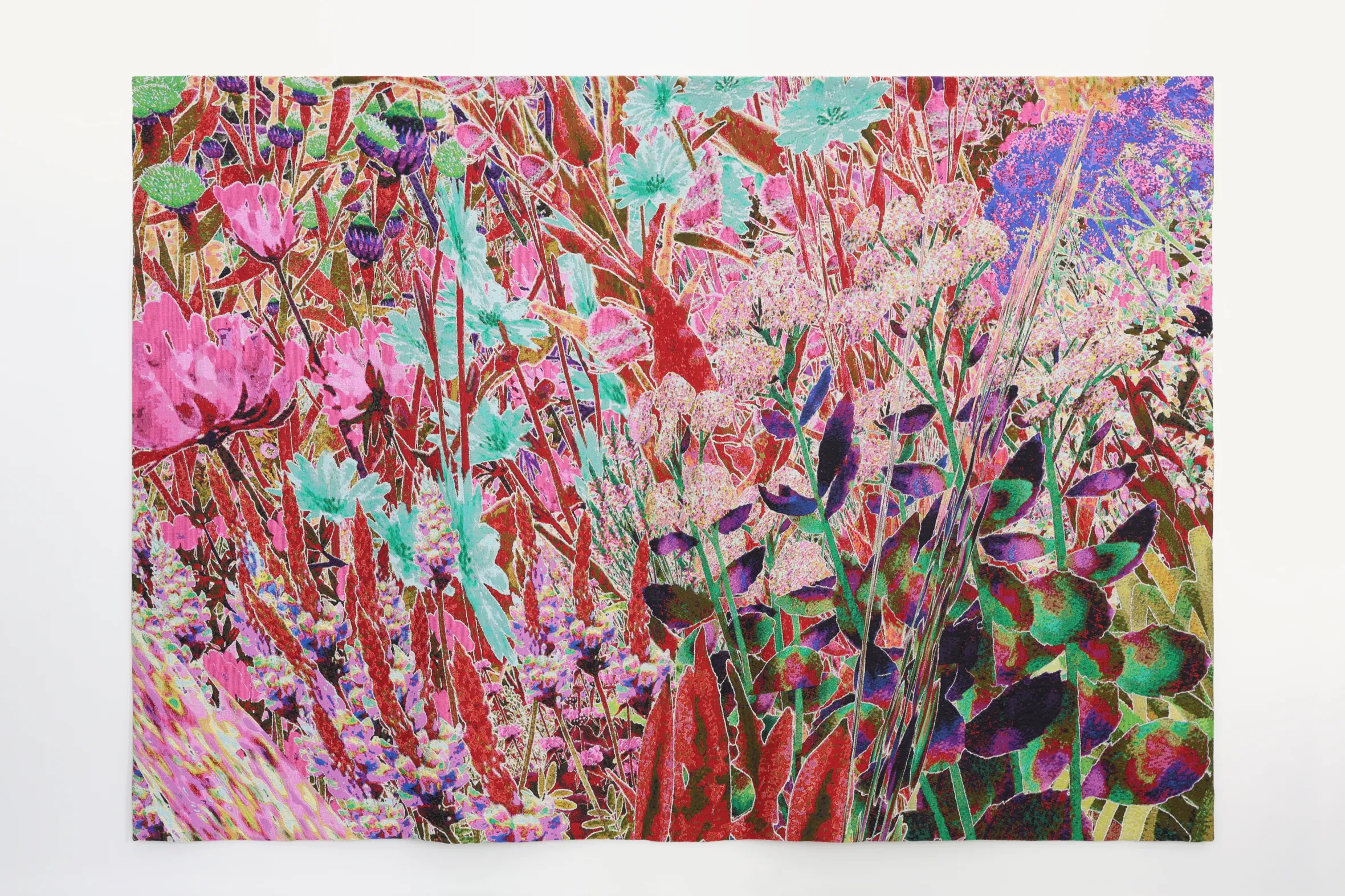 A vibrant tapestry with a dense arrangement of colorful plants and flowers in shades of pink, red, green, and blue.