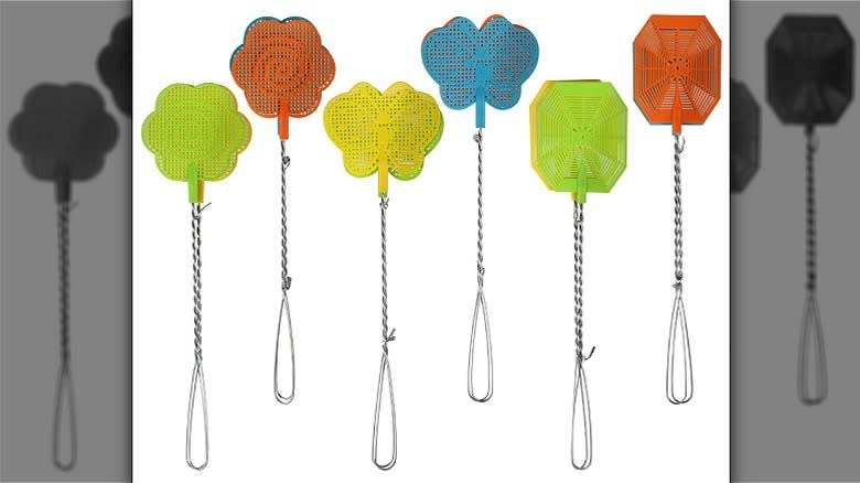 Colorful fly swatters in the shape of flowers, butterflies, or octagons.