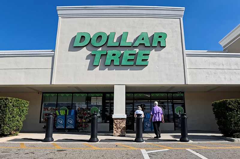 Lakeland, Florida USA - 01 05 26: Dollar tree retail store and people clear blue sky