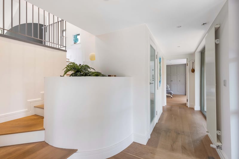 The property has many architectural details such as curved walls and vaulted ceilings