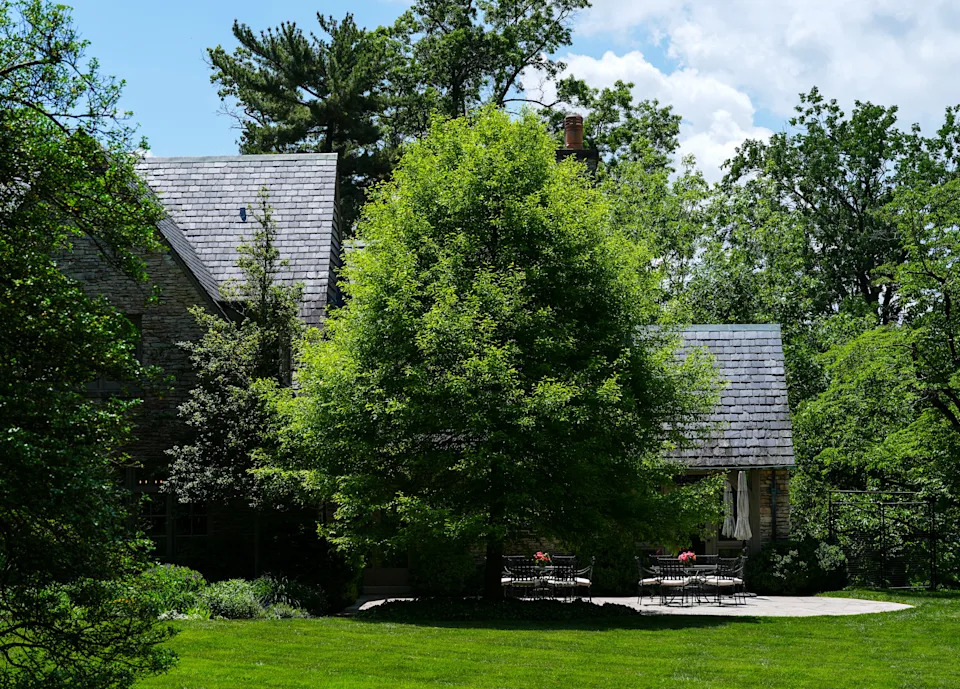 The patio of the Gibbs home with accents of color from two floral arrangements. May 14, 2025