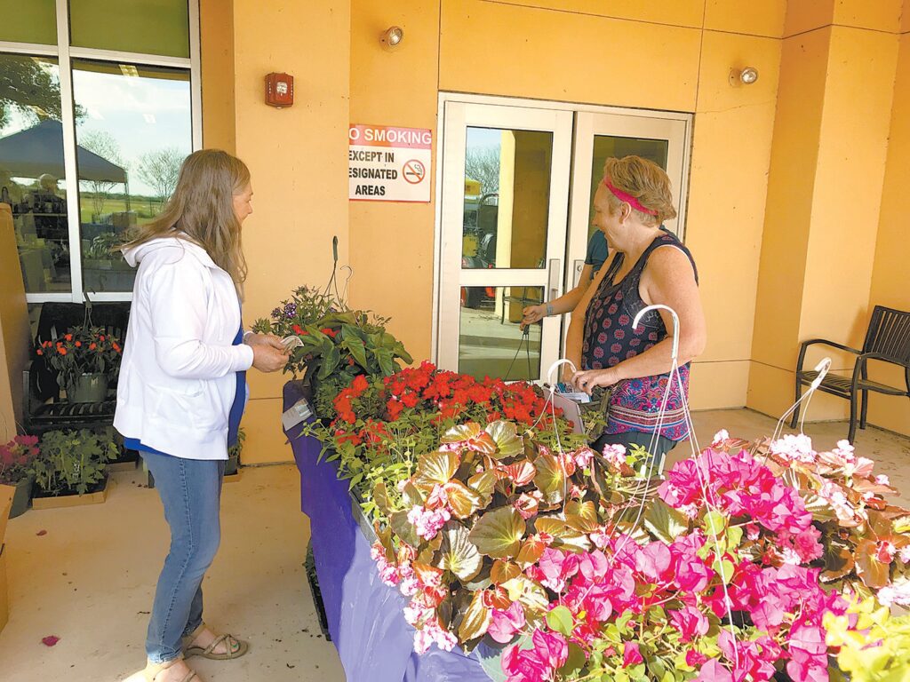 A shopper peruses plants at one of the many booths at a past South Texas Home and Garden Show. Find indoor and outdoor plants, gardening advice, home and garden décor, contractors, crafts, and much more at this year’s show, taking place this Saturday, March 21, at the Floresville Event Center! WCN FILE PHOTO